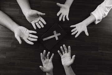 Hands of youths praying with crosses on the table, concept of hope, faith, christianity, church...