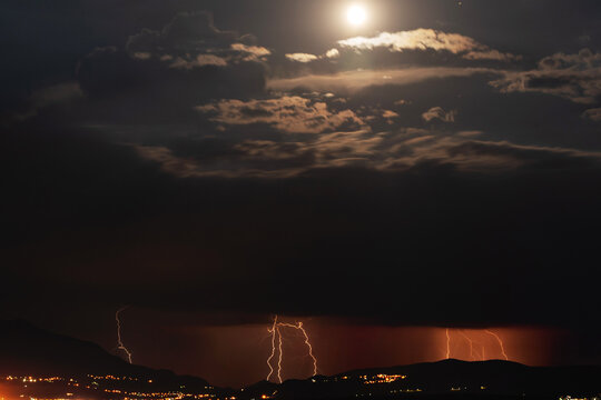 Night thunderstorm in the light of the moon. Amazing view