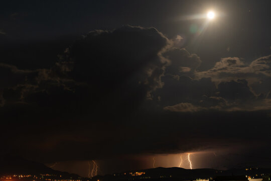 Night thunderstorm in the light of the moon. Amazing view