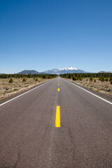 Long road off into the distance towards the horizon in the USA	