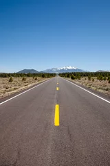 Foto auf Acrylglas Antireflex Long road off into the distance towards the horizon in the USA  © wayne