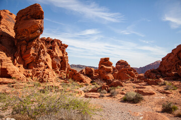 Fototapeta na wymiar Red sandstone eroded with a road winding through the national park in America