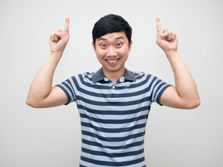 Young man striped shirt gentle smile double point finger up above