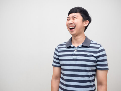 Happiness man striped shirt laugh and looking at copy space