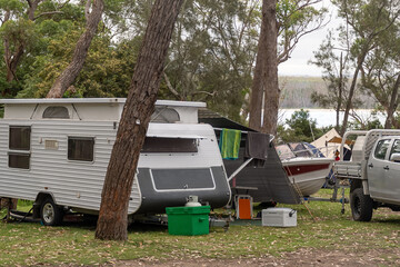 RV caravan camper on a campsite at holiday caravan park surrounding by nature