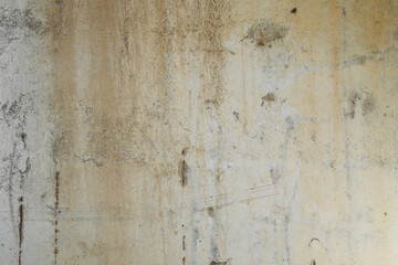 The texture is old, dirty with brown streaks concrete slab.
