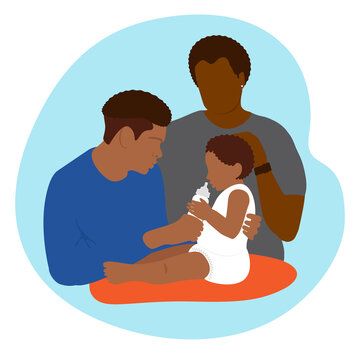 African American inclusive family with a child. Parental care for children. The father takes care of the child, feeds him with milk formula from a bottle. Parental responsibilities. Infant nutrition. 