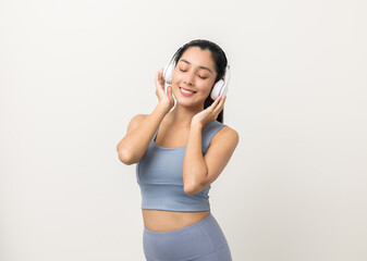 Naklejka premium Sexy sporty fitness asian woman with sportswear put on headphone isolated white background. Portrait Good shape and healthy woman standing pose exercise workout in studio.