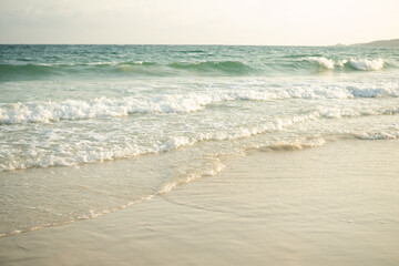 Soft wave on sand beach at coast with blue sea ocean tropical nature. tourism vacation travel summer in holidays. white texture wallpaper island flat lay.