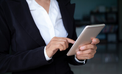 Senior woman use touchscreen mobile. she working in office. communication wireless internet hi speed.staff woman professional. technology for business or finance concept.