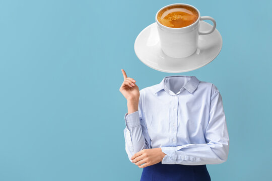 Businesswoman with cup of hot coffee instead of her head on light blue background