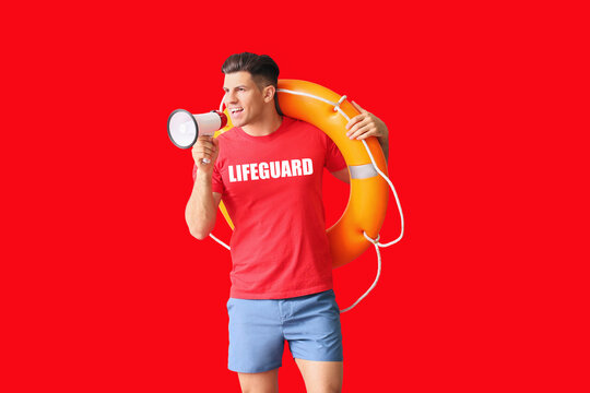Beach rescuer with lifebuoy and megaphone on red background