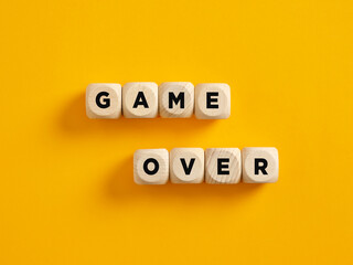 The word game over on wooden cubes. Failure, loosing or gaming