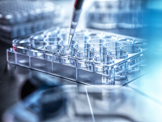 Pipetting sample in tubules at laboratory