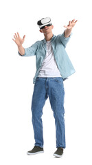 Young guy in VR glasses on white background