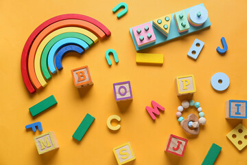 Educational toys on yellow background
