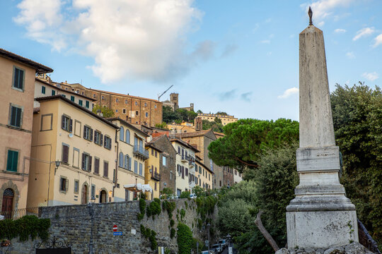 Italy, Province of Arezzo, Cortona, Monument at Piazza Garibaldi with town houses in background