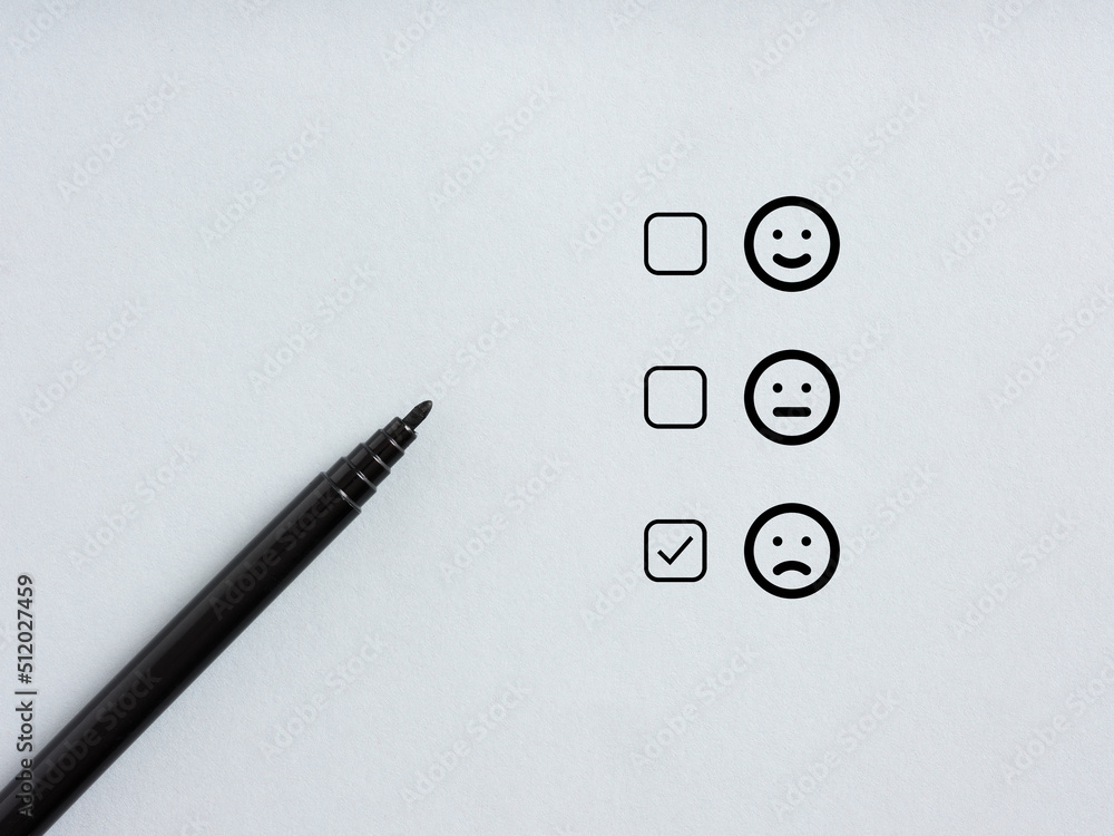 Poster tick placed in checkbox of selected unhappy emoticon. customer satisfaction and negative client feed