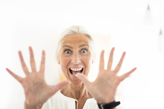 Excited woman showing palm of hands