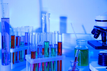Laboratory glassware on blue background