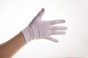 Hands gesticulating in white textile gloves on a white background