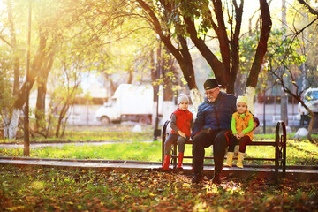 Fototapeta premium Children walk in the autumn park