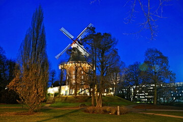 Germany-view of historic windmill at night in Bremen - obrazy, fototapety, plakaty