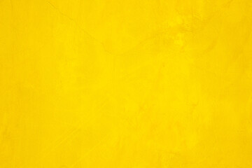Concrete wall yellow color for texture background. Abstract grunge bright colorful color background with growing effect. Pastel yellow colored low contrast textured with roughness and irregularities.