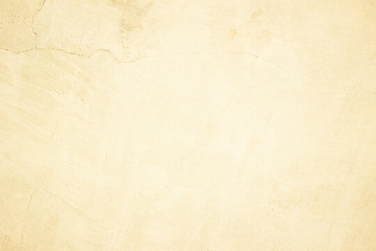 Old concrete wall texture background. Close up retro plain cream color cement material surface.