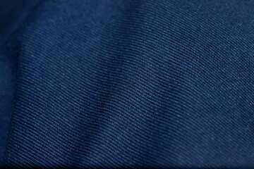 blue fabric with folds close-up, texture, background