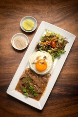 Traditional cambodian Lok Lak stir fried beef with rice meal