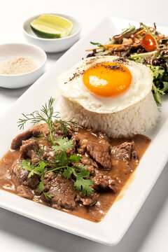 Traditional cambodian Lok Lak stir fried beef with rice meal