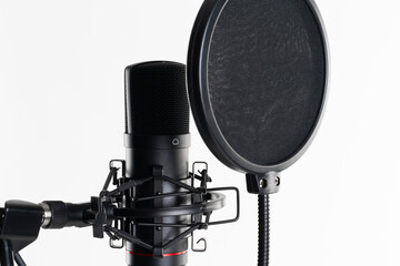 A close up image of proffesional studio microphone isolated on the white background