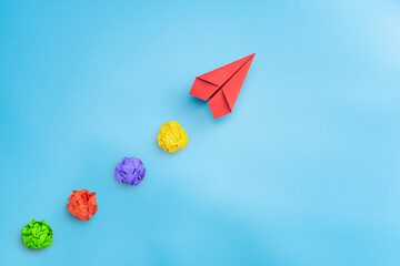 Creative idea. Concept of idea, innovation and Inspiration with Red paper plane and crumpled paper,...