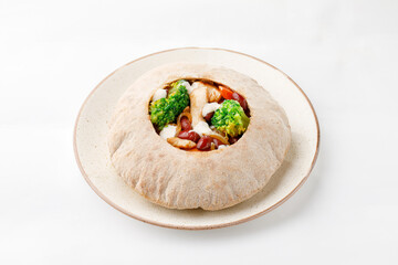 Pita with chicken with broccoli vegetables on a white background