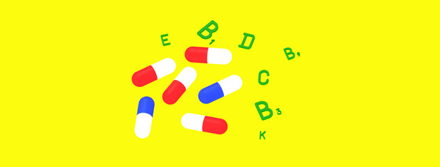 medical capsules of different colors. detection of vitamins by green color symbols. healthy food concept. Banner for insertion into site. Place for text cope space. Horizontal image. 