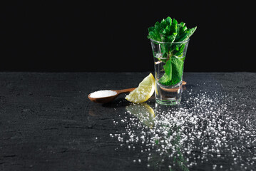 Mexican tequila with lime and salt on a black background. place for text. luxury drink concept. Alcoholic drink