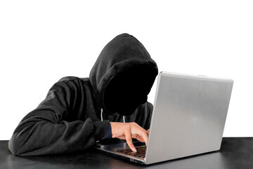 Hooded hacker using a laptop on studio