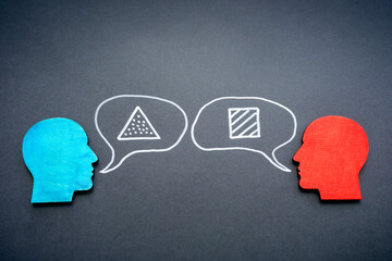 Colored figurines of heads. Communication problems and skills concept.