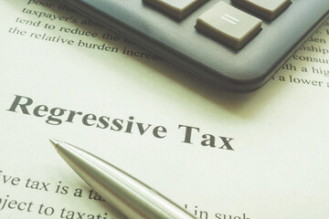 Regressive tax page, a calculator and pen.