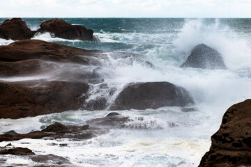 Rough sea and big waves hit rocks in northern France.