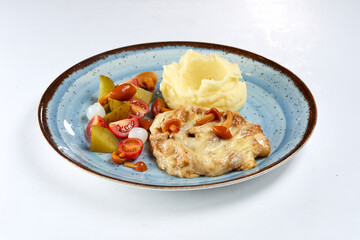 pork with mashed potato and vegetables