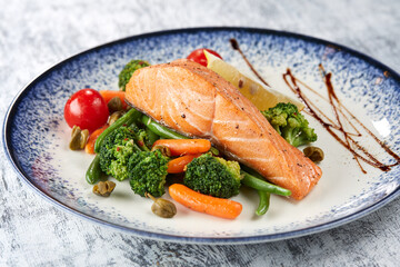 salmon steak with roasted vegetables