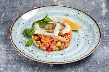 white fish with rice and vegetables