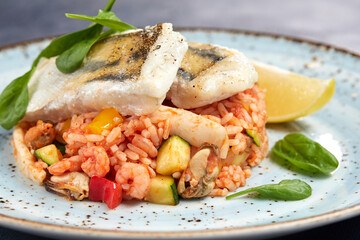 white fish with rice and vegetables