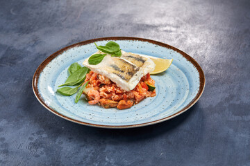 white fish with rice and vegetables