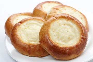 baked sweet buns on the white plate