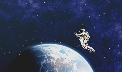 Astronaut spacewalk in space near Earth and pointing his finger