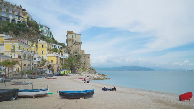 Cetara, Italy. Time lapse video of the beach of the old village of Cetara and old buildings and tower near the sea. May 6th, 2021.