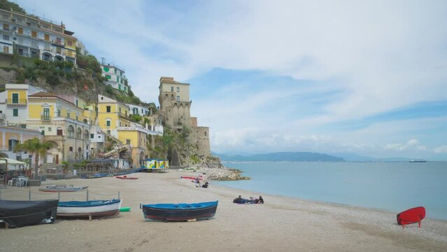 Cetara, Italy. Time lapse video of the beach of the old village of Cetara and old buildings and tower near the sea. May 6th, 2021.